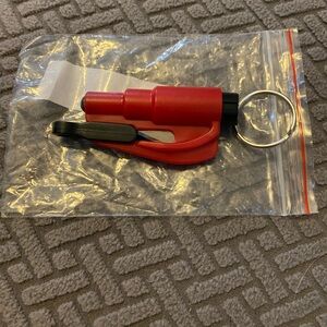 New in package, Safety keychain. Window breaker, seatbelt slicer